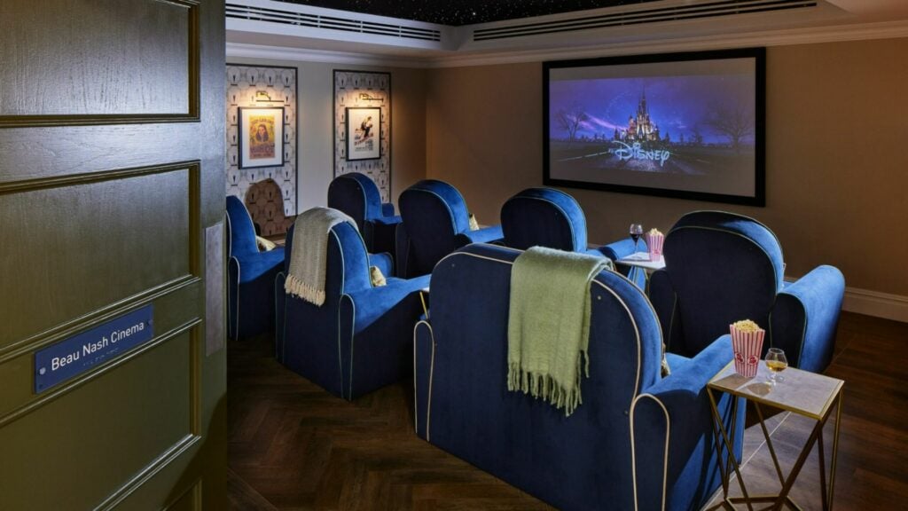 Luxurious home cinema room with Disney movie playing.