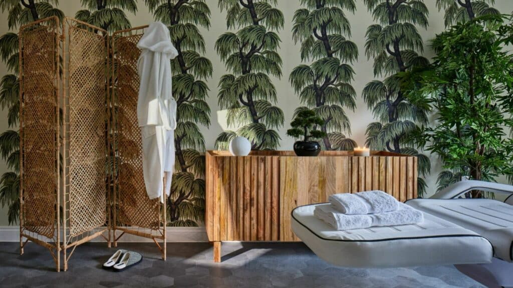 Luxurious spa room with tropical decor.