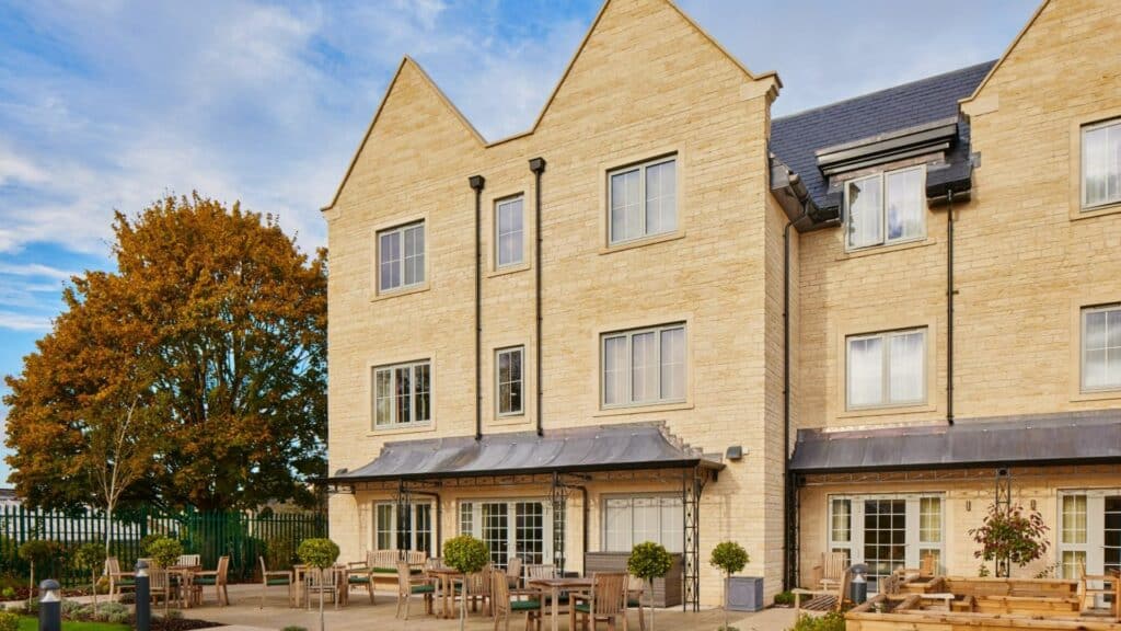 Modern building with outdoor seating area.