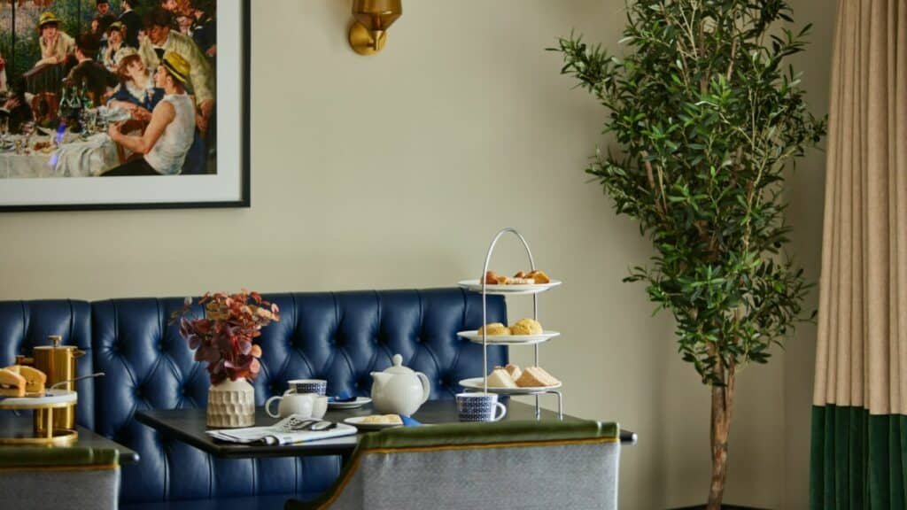 Cosy afternoon tea setup with snacks and drinks.