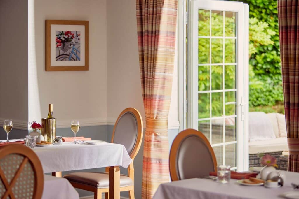 Cosy restaurant interior with open door