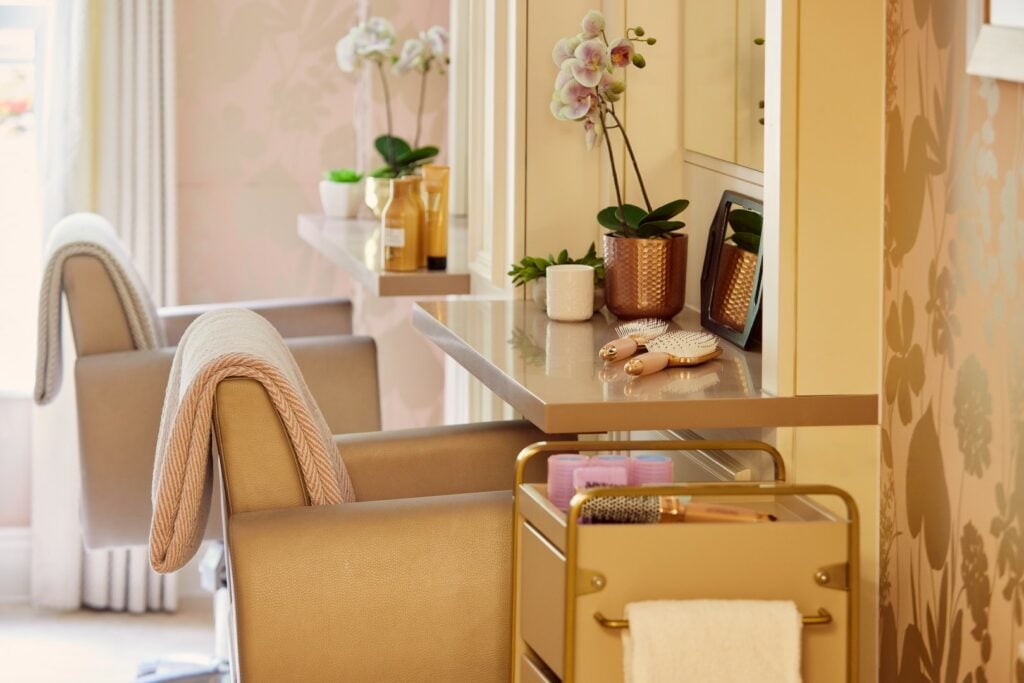 Modern hair salon with chairs and grooming tools.