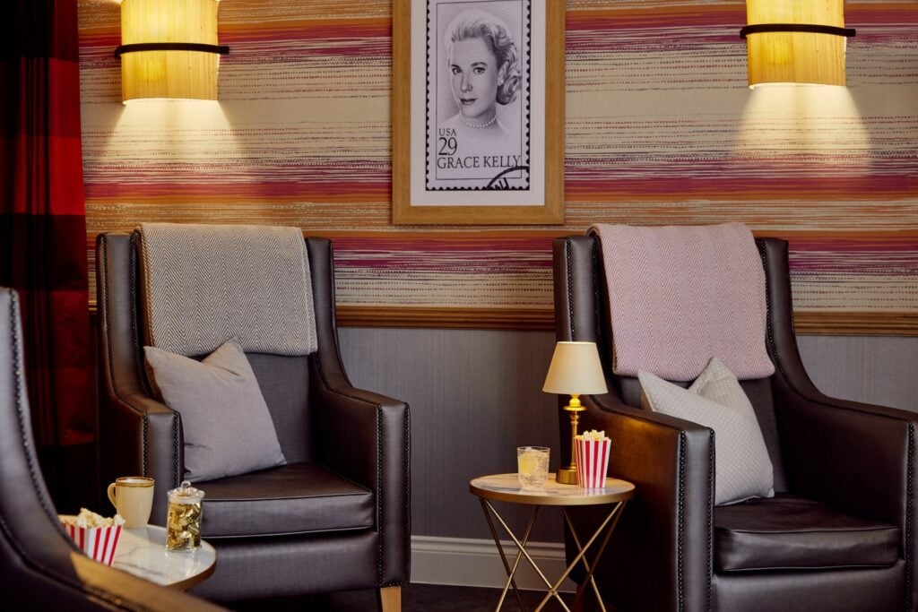 Cosy seating area with framed photo and popcorn.