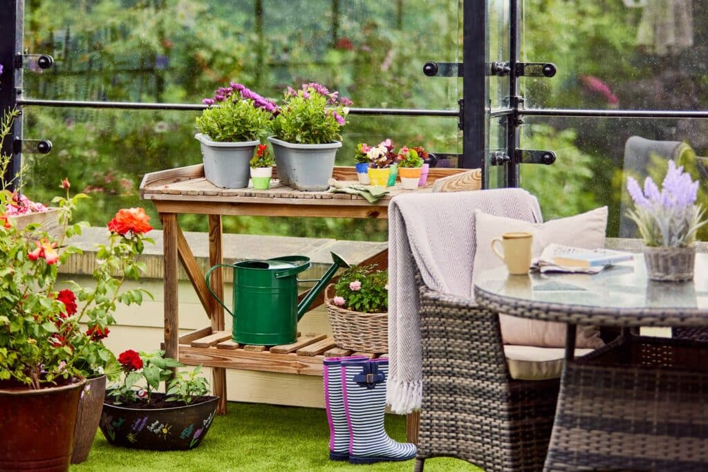Cosy garden setup with plants and coffee cup.