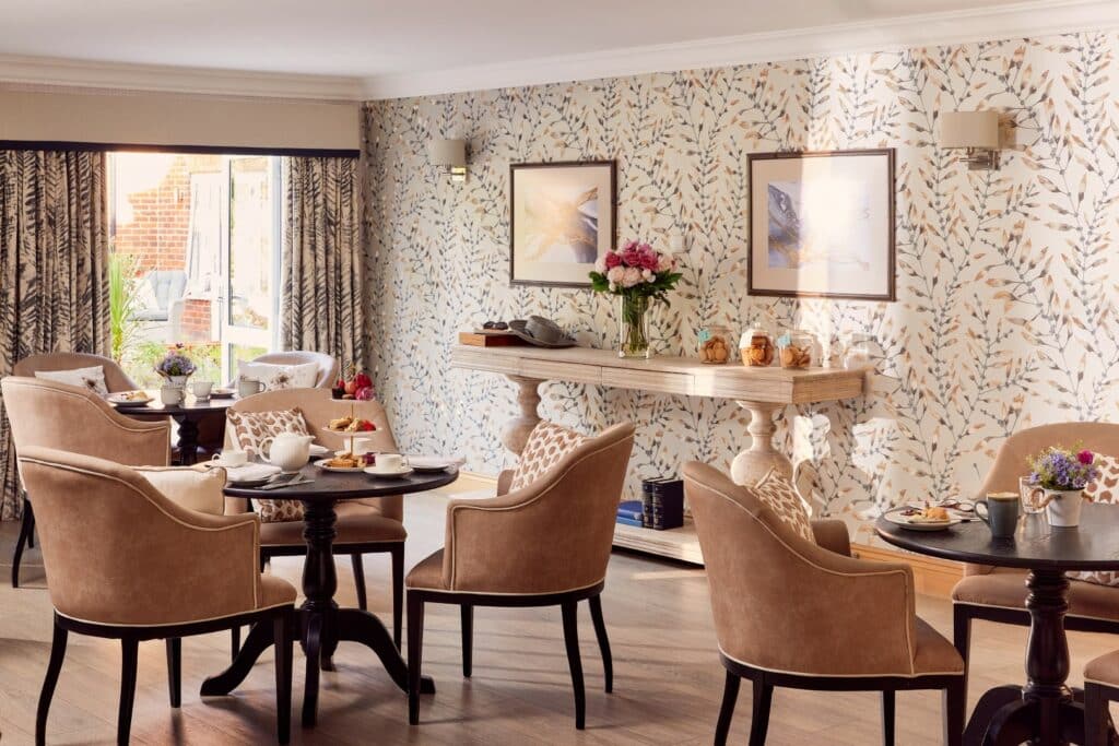 Cosy café with elegant decor and seating arrangement.