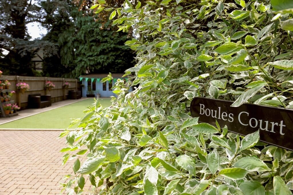 Lush garden with boules court and foliage