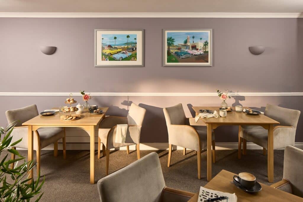 Cosy café with wooden tables and afternoon tea setup