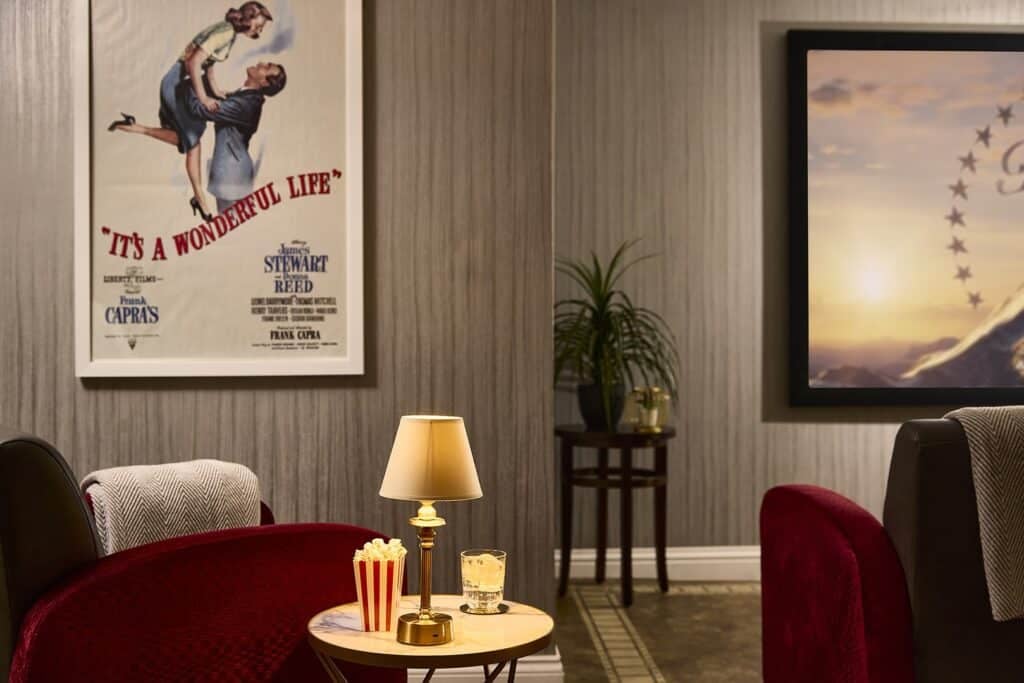 Cosy home cinema with red chairs and decor