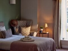 Cosy bedroom with natural light and stylish decor.