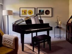 Elegant living room with grand piano and saxophone.
