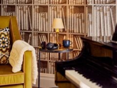 Cosy reading nook with headphones, lamp, and coffee mug.