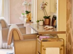 Modern hair salon with chairs and grooming tools.