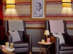 Cosy seating area with framed photo and popcorn.