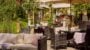 Garden with patio furniture and umbrellas.