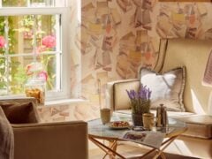 Cosy sitting area with flowers and coffee.