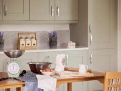 Kitchen baking setup with ingredients and utensils.