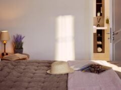 Cosy bedroom with a hat on the bed