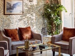 Stylish living room with floral wallpaper and comfy seating
