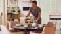 Woman arranging afternoon tea in cosy sitting room.