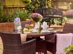 Garden tea party with cake and flowers.