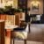 Elegant restaurant with modern decor and colourful chairs.