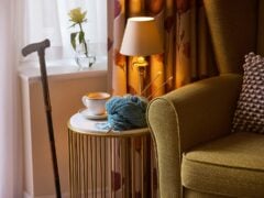 Cosy sitting area with coffee and knitting supplies.