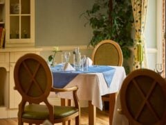 Elegant restaurant table setting with blue accents.