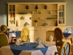 Cosy dining room with elegant decor and table settings.