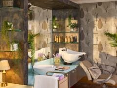 Modern salon with elegant decor and plants.