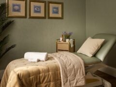 Tranquil massage room with neutral tones and decor.