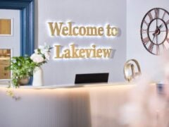 Reception area with 'Welcome to Lakeview' sign.
