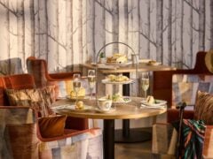 Elegant afternoon tea setup in cosy restaurant.