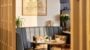Cosy cafe booth with map artwork and flowers.