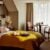 Cosy hotel room with bed and window view.
