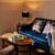 Cosy lounge with blue sofa and floral cushions.
