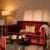 Cosy living room with red sofa and lamp
