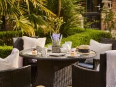 Outdoor table setting with tea and cupcakes