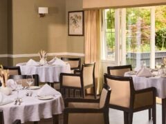 Elegant restaurant with tables set for dining.