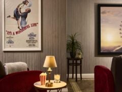 Cosy home cinema with red chairs and decor