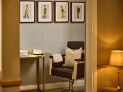 Elegant barber chair in warmly lit room
