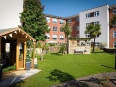 Modern care home garden with seating area
