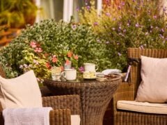 Outdoor wicker table with tea and scones