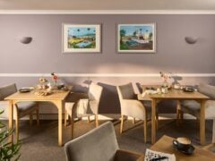 Cosy café with wooden tables and afternoon tea setup