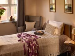 Cozy bedroom with single bed and armchair