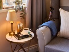 Cosy reading corner with tea and lamp