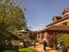 Sunny garden outside brick residential building