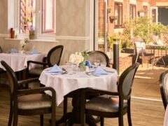 Elegant restaurant dining area with outdoor garden view