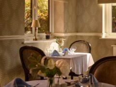 Elegant restaurant table set for two by window