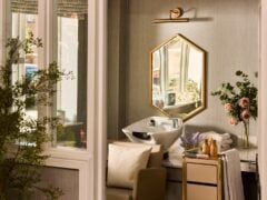 Elegant hair salon sink with mirror and flowers