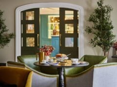 Cosy café setup with cakes and tea.